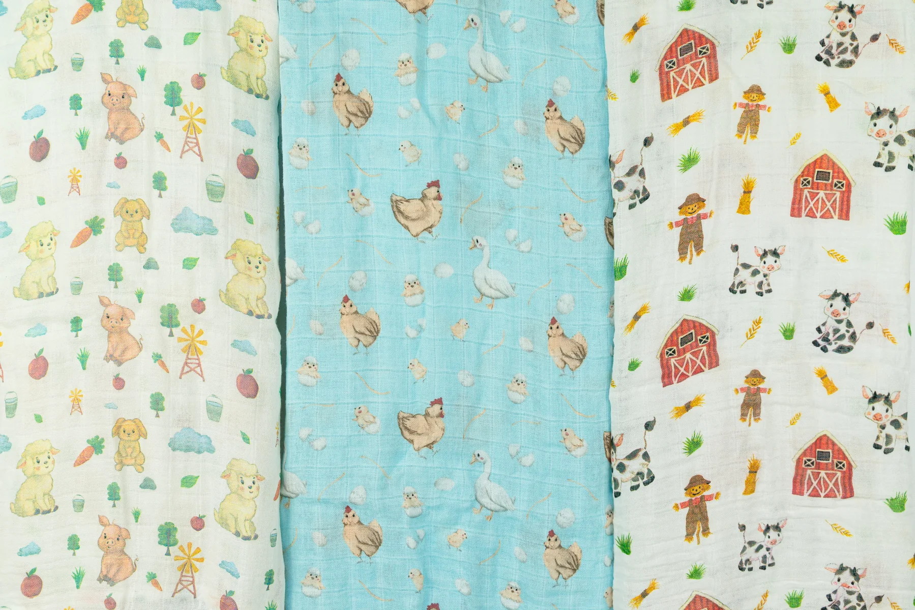 Close-up of farm pattern Mama Cookie bamboo muslin swaddles